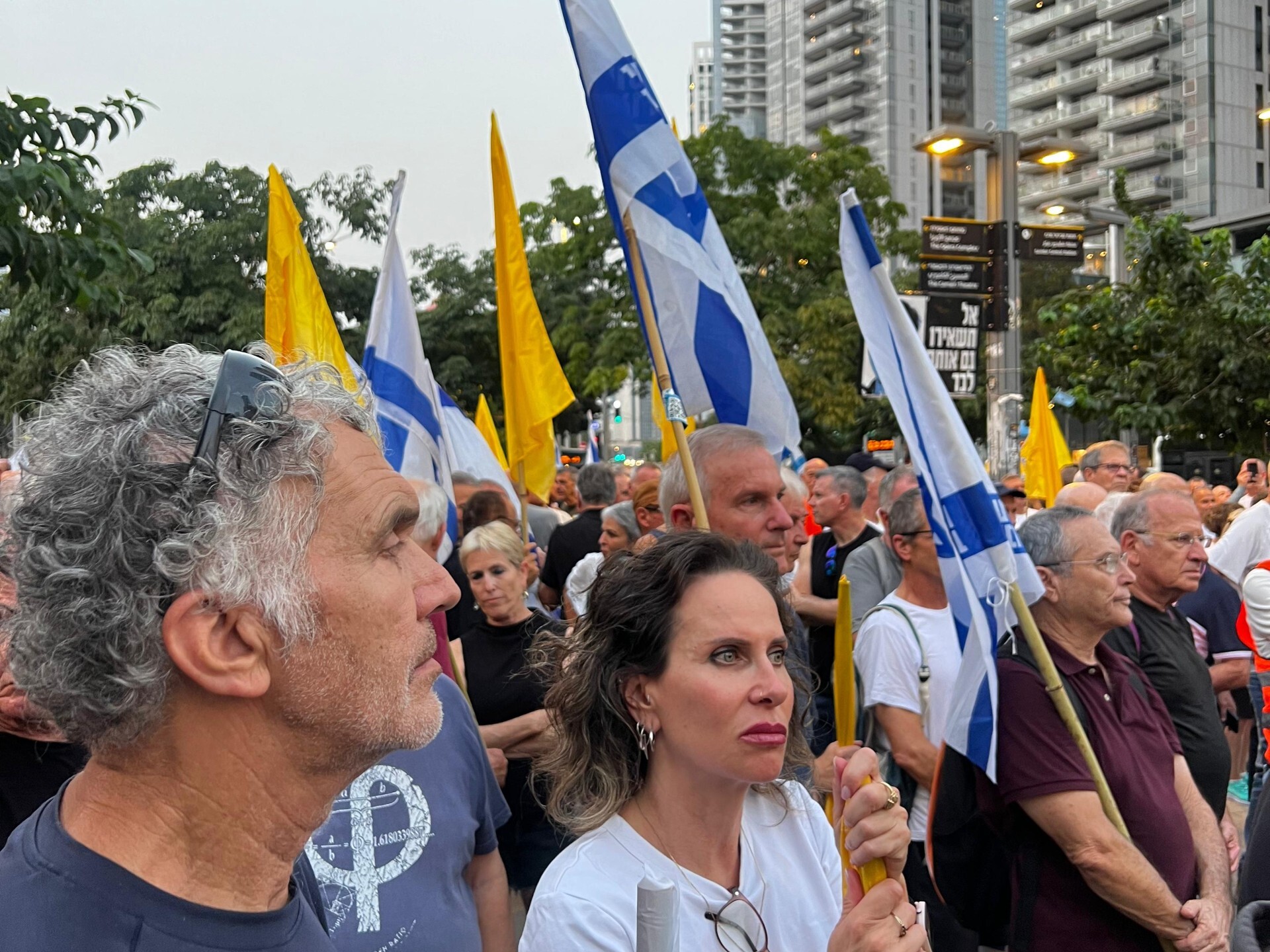caption: Retired Israeli Air Force pilots protest against the war in Gaza outside the country's defense ministry headquarters in Tel Aviv on August 12, 2025