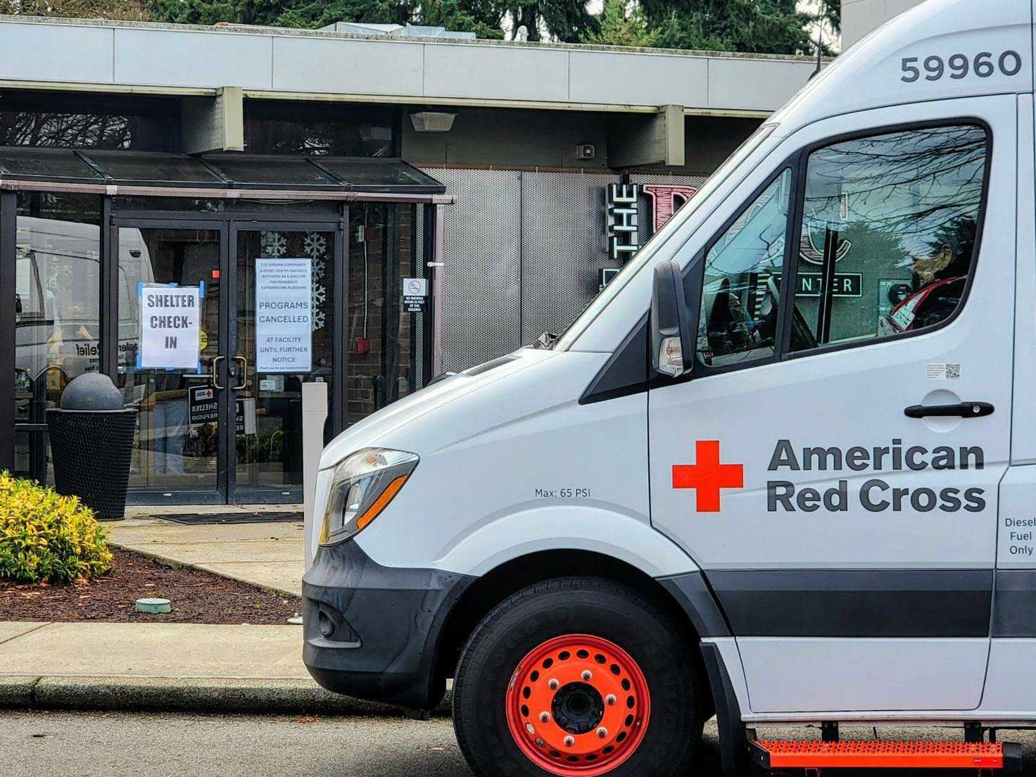 caption: An American Red Cross van drops off supplies and workers at an emergency flood shelter in Auburn on Wednesday, Dec. 17, 205.