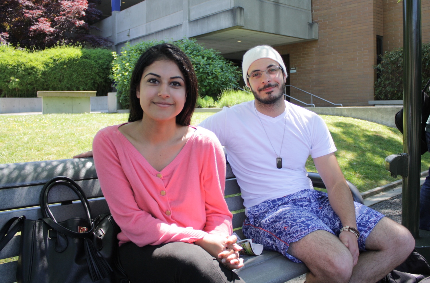 caption: Bellevue College student Ravneet Sandhu (left) lives with her family to save money and commute time. Her friend  Noureddine Kassab is an international student from Lebanon.  