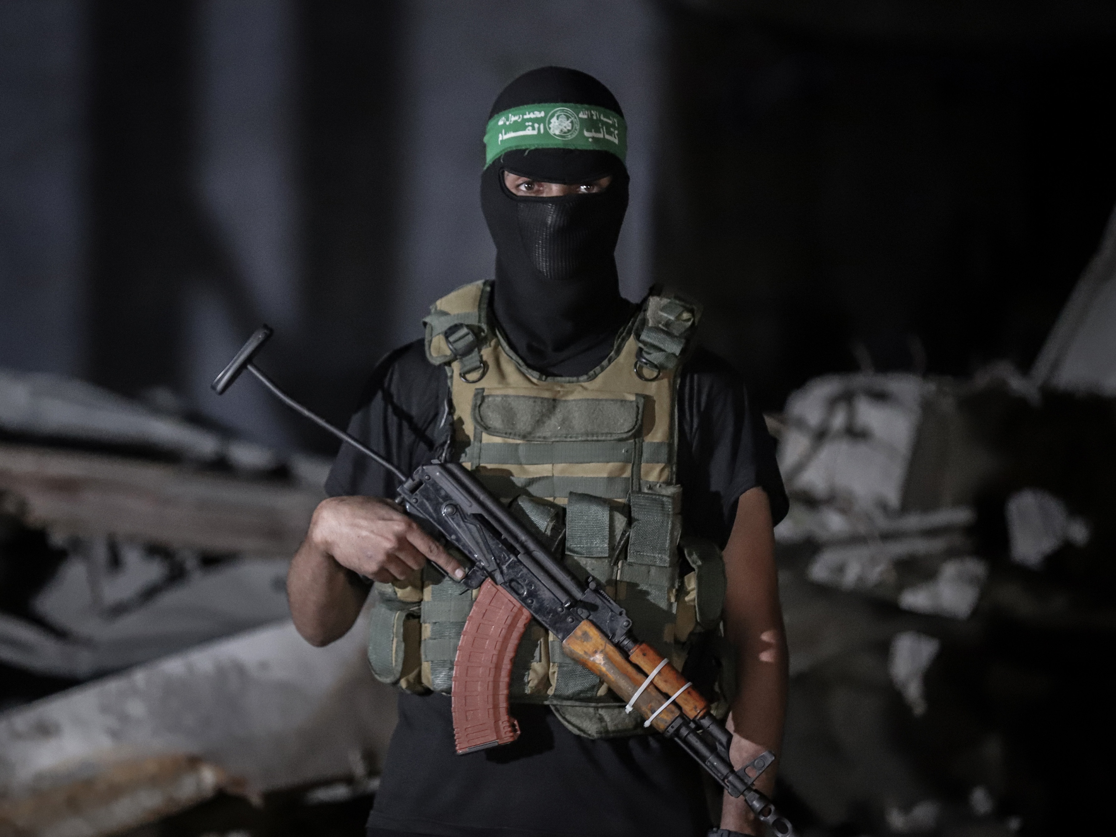 caption: A Palestinian militant wearing the uniform of the al-Qassam Brigades, the military wing of Hamas,  Oct. 15, 2025.