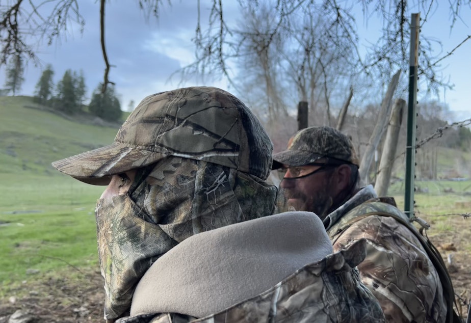 caption: Keely Hopkins and Aaron Garcia hunt turkeys on a private property in Rice, Washington. Hopkins participated in a mentored turkey hunt, designed to teach people how to hunt.