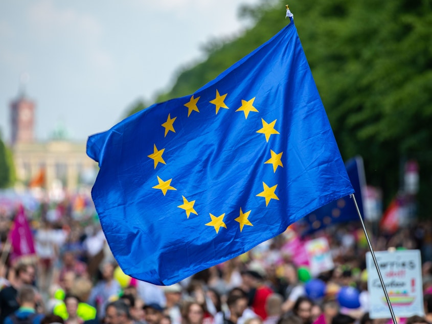 caption: A protester waves the European Union flag during the pro-Europe demonstration "One Europe for All: Your voice against nationalism," a week before Sunday's European elections in Berlin, on May 19.