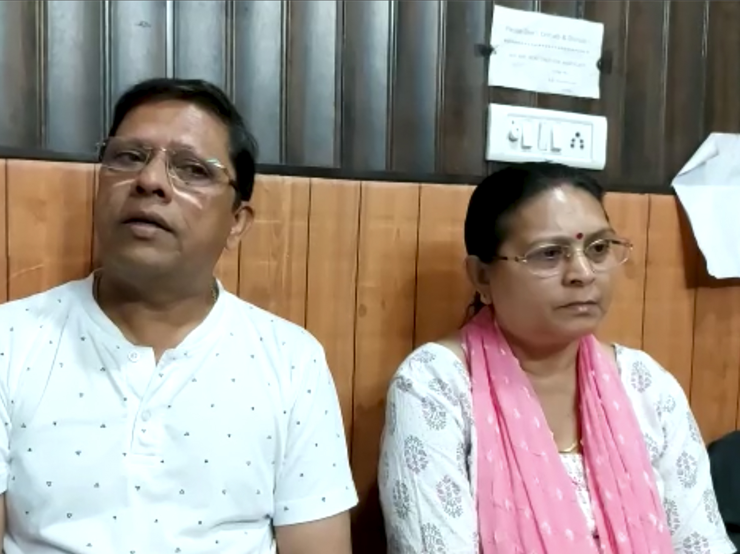 caption: This image from video shows Sanjeev Ranjan Prasad, a 61-year-old retired government officer, and his wife Sadhana Prasad as they wait at a lawyer's chamber in Haridwar, India, on Thursday. The couple has sued their son and daughter-in-law, demanding a grandchild within a year or compensation of 50 million rupees ($675,675).