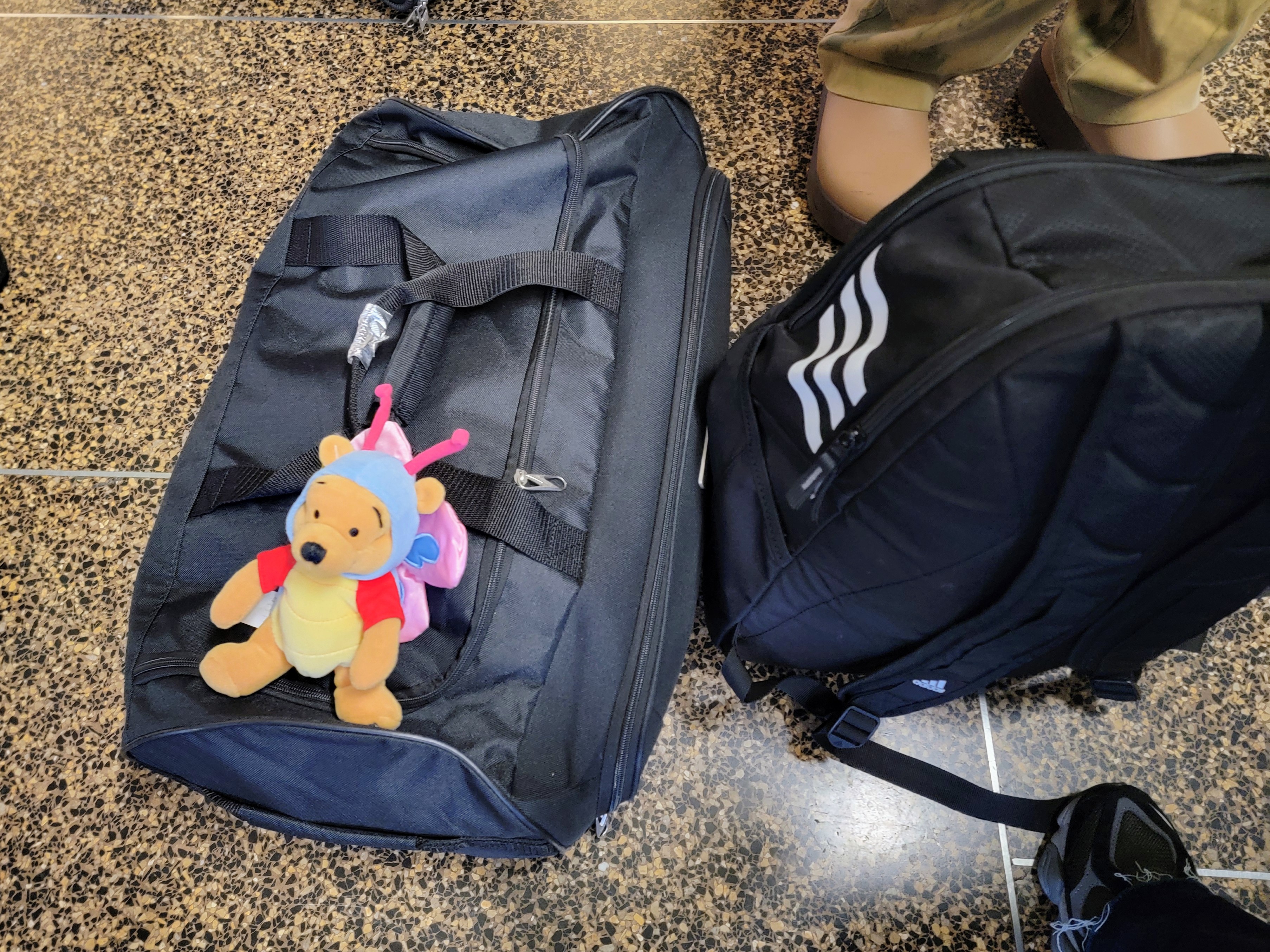 caption: Migrant advocates brought small toys and snacks for the two kids before they left on their flight on Wednesday, Jan. 7, 2026.