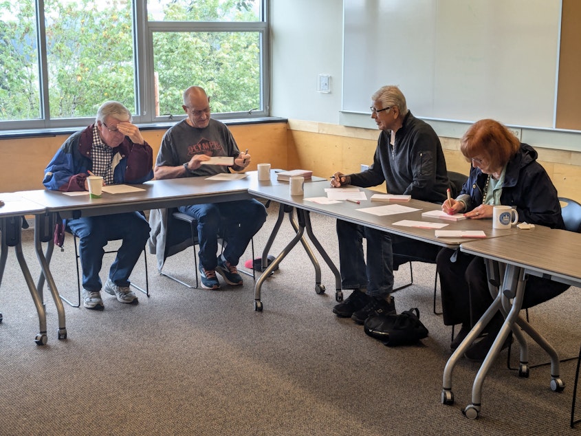 caption: On Sept. 17, 2024, AARP members gathered at the Mercer Island Community Center to sign postcards urging others to vote down Initiative 2124.