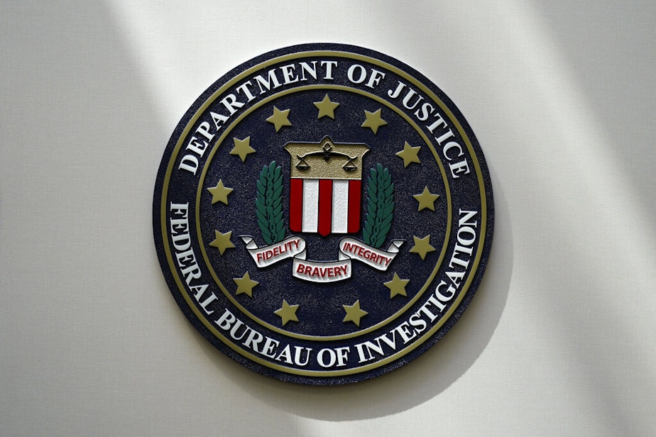 caption: An FBI seal is seen on a wall on Aug. 10, 2022, in Omaha, Neb. 