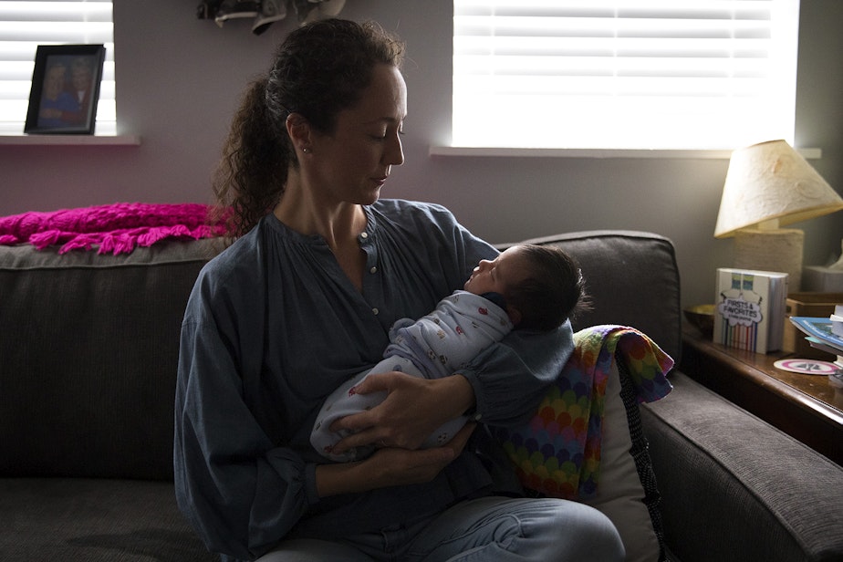 caption: Sarah Orza holds newborn Gloria Carpenter during an appointment on Thursday, August 8, 2019, in Seattle. 