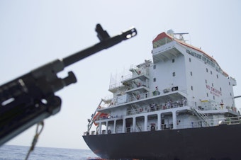 caption: The U.S. Navy says a hole was made by a limpet mine on this Panama-flagged, Japanese-owned tanker anchored off Fujairah, United Arab Emirates. The limpet mines used to attack the tanker near the Strait of Hormuz resembles similar mines displayed by Iran, a Navy explosives expert said Wednesday. Iran denies being involved.