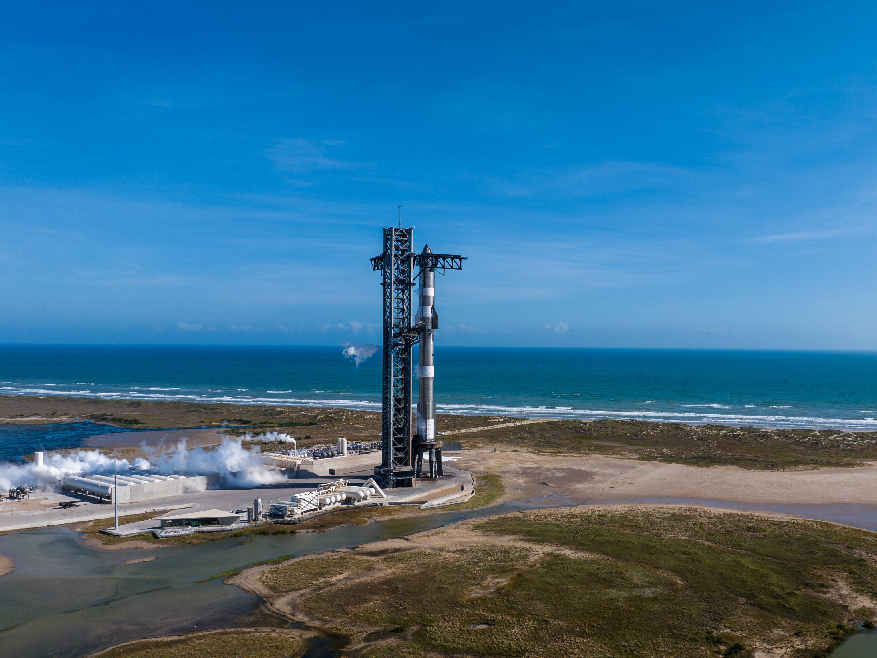 caption: SpaceX's Starship sits at its Boca Chica launch pad. The launch is set to happen on November 19.