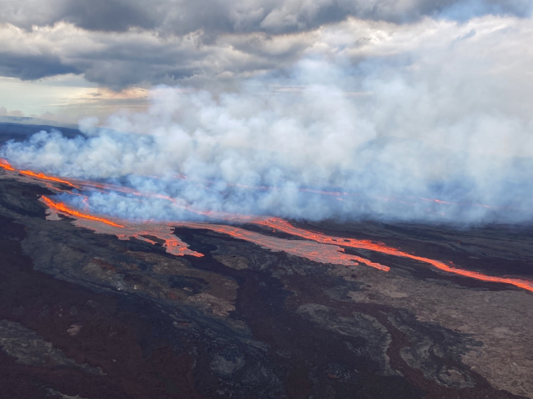 caption: In this aerial photo released Monday by the U.S. Geological Survey, the Mauna Loa volcano is seen erupting from vents on the Northeast Rift Zone on the Big Island of Hawaii.