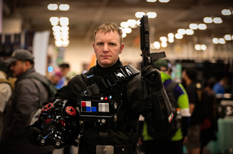caption: Star Wars cosplayer Cedar Lau walks the show floor at Emerald City Comic Con 2024 at the Seattle Convention Center. 