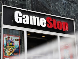 caption: Shares of video game retailer GameStop shot up, the online broker Robinhood struggled for cash and securities regulators issued a stern warning for anyone trying to game the market.