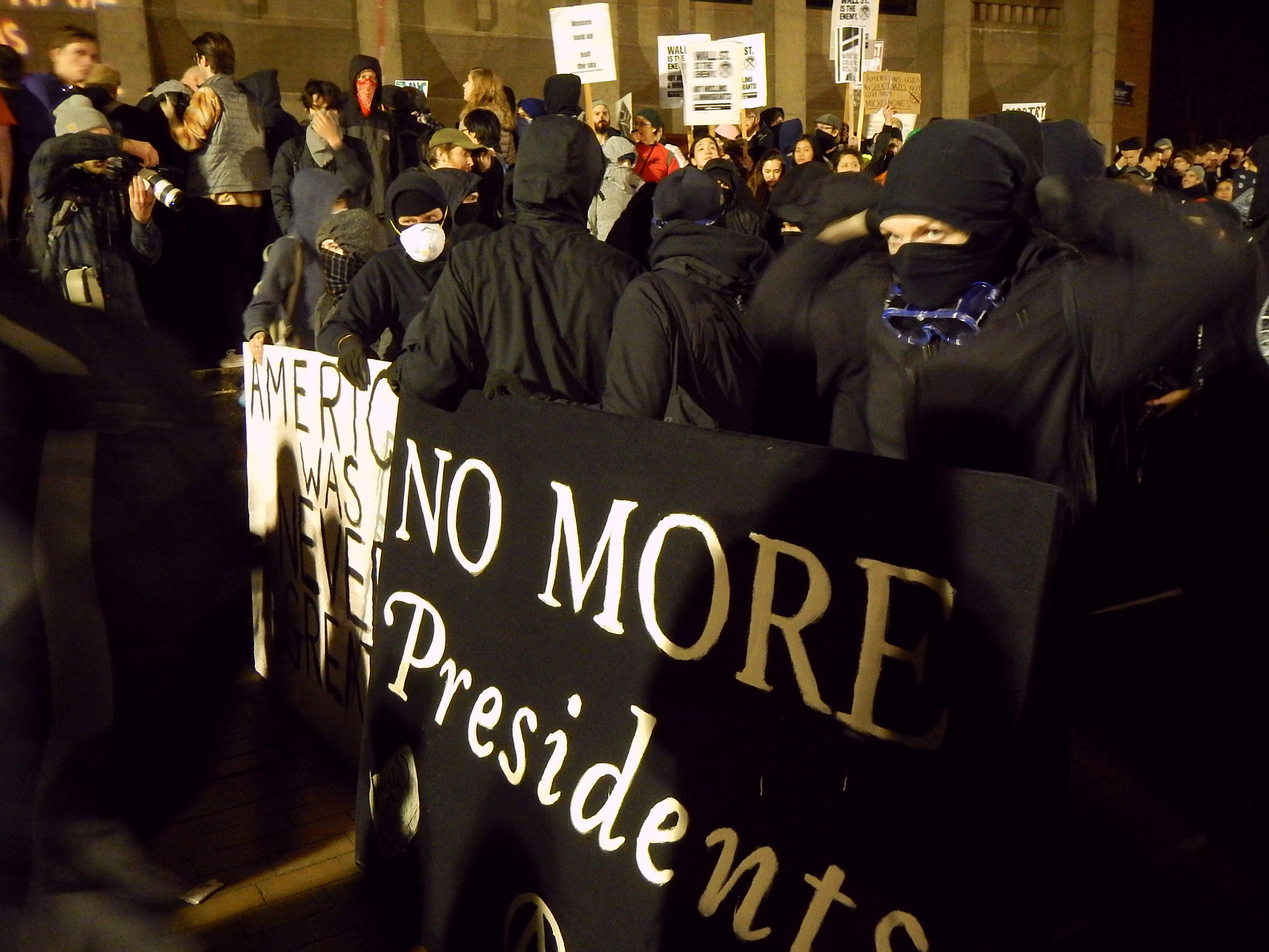 caption: Protesters crowd into the University of Washington's Red Square on Friday, January 20, 2017 during a speech by Breitbart editor Milo Yiannopoulos.
