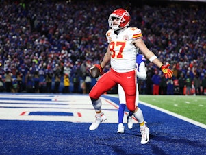 caption: Travis Kelce of the Kansas City Chiefs celebrates after scoring a 22-yard touchdown against the Buffalo Bills during the second quarter in the AFC Divisional Playoff game at Highmark Stadium in Orchard Park, N.Y., on Sunday.