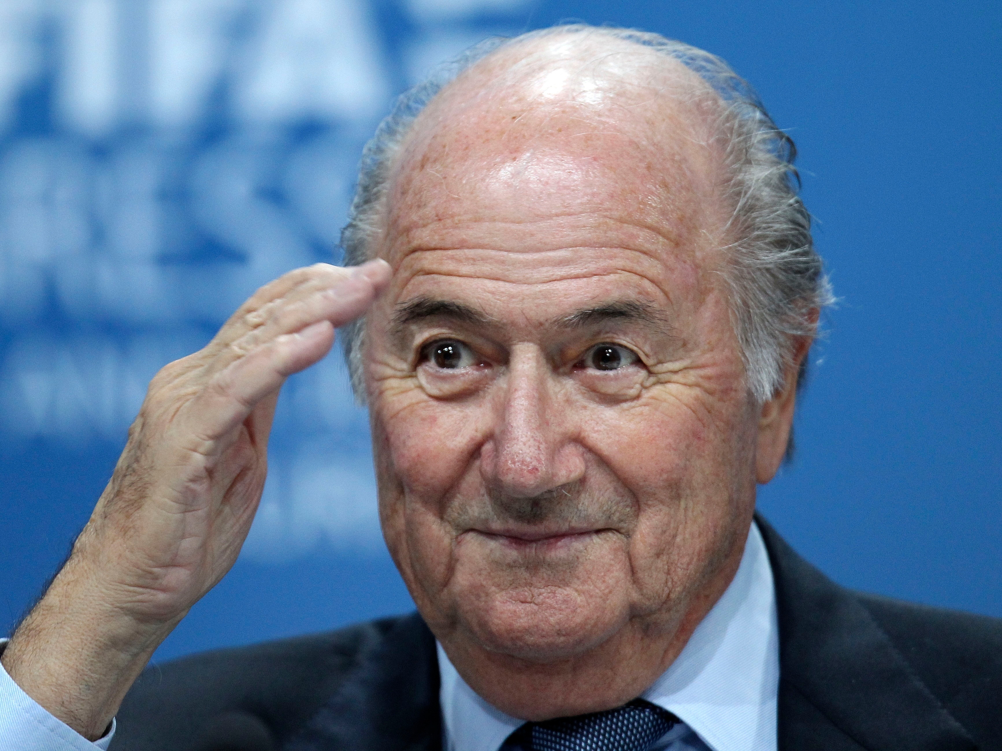 caption: In this June 1, 2011, file photo, Sepp Blatter gestures during a press conference in Zurich, Switzerland.