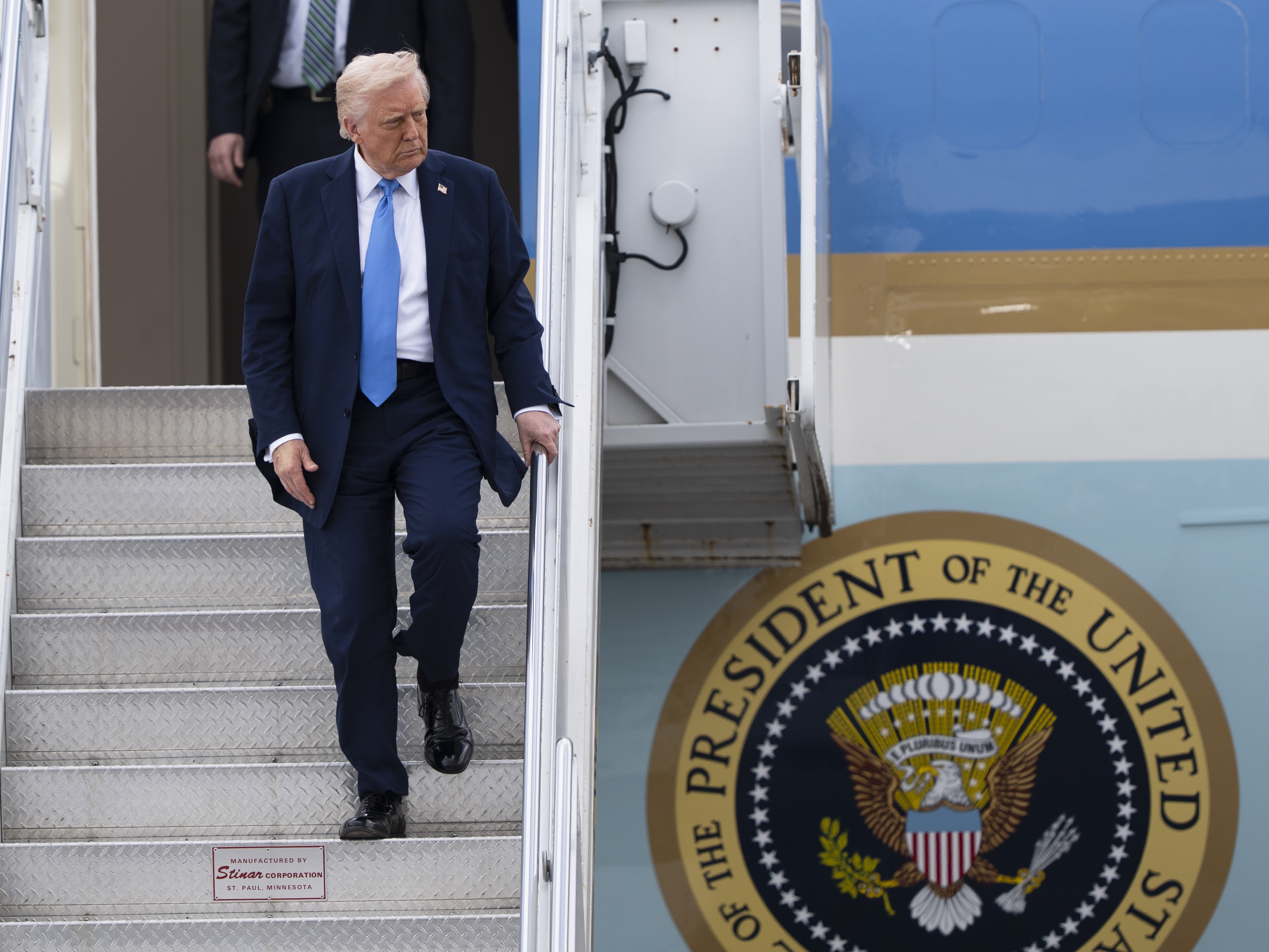 caption: President Trump arrives at Palm Beach International Airport in West Palm Beach, Fla., on Friday aboard Air Force One.