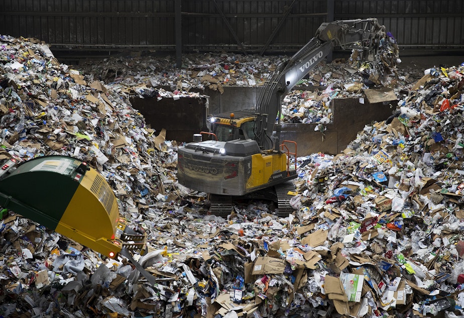 caption: A large pile of recyclables forms where arriving trucks dump the materials before they are sorted on Friday, October 26, 2018, at Cascade Recycling Center in Woodinville. 