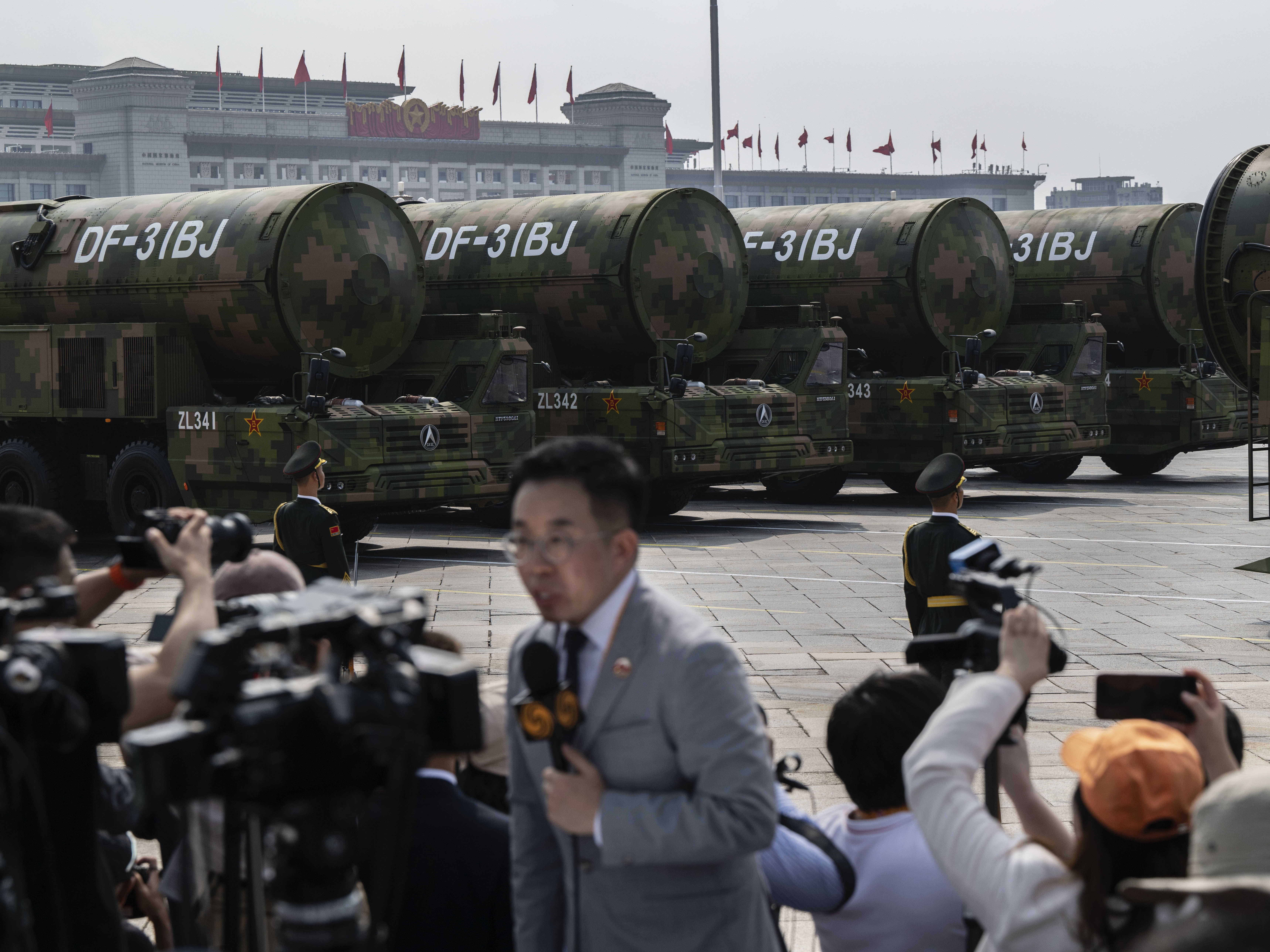 caption: Nuclear capable DF-31BJ ballistic missiles are shown on transporters during a military parade in Beijing, China on September 3, 2025. China is undergoing a massive expansion of its nuclear arsenal.
