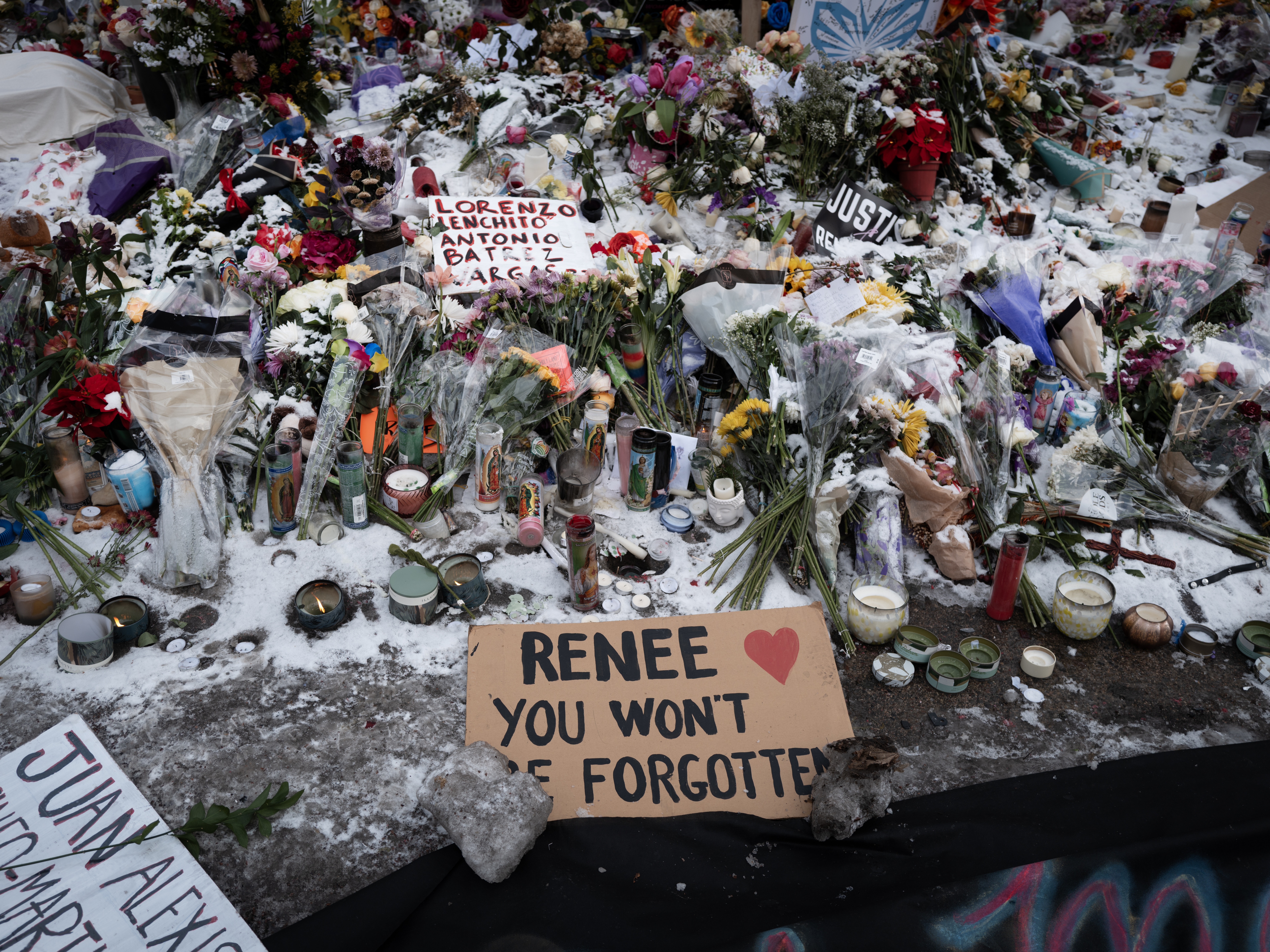 caption: Snow covers a memorial to Renee Macklin Good on Jan. 10 in Minneapolis.