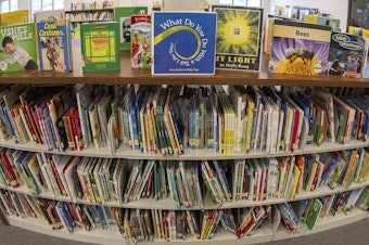 caption: Books seen in an elementary school library in suburban Atlanta on Aug. 18. There have been a growing number of books pulled from school libraries in the past few years.