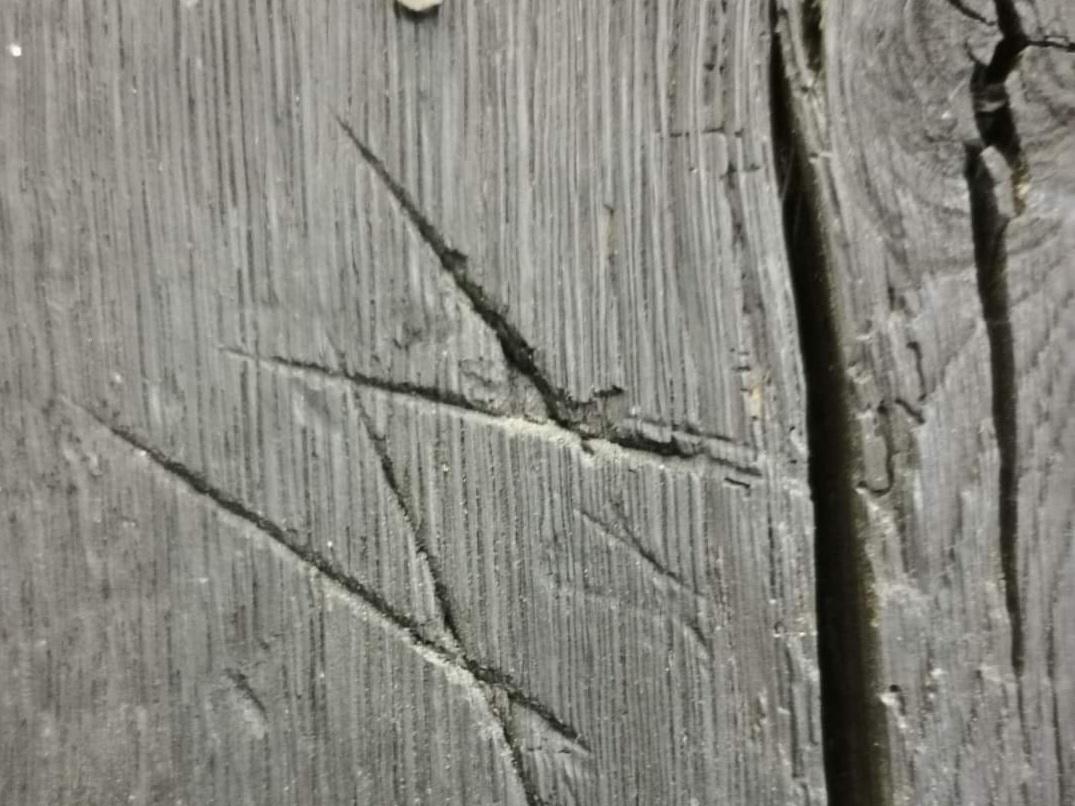 caption: Overlapping V's, or Marian marks, were among the designs meant to ward off evil that were found carved into the walls at Gainsborough Old Hall in Lincolnshire, England.