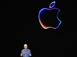 caption: Apple CEO Tim Cook speaks during Apple's annual Worldwide Developers Conference (WDC) in June. Many of the features Apple announced there will duplicate the services of 3rd-party apps, a practice known as "Sherlocking."