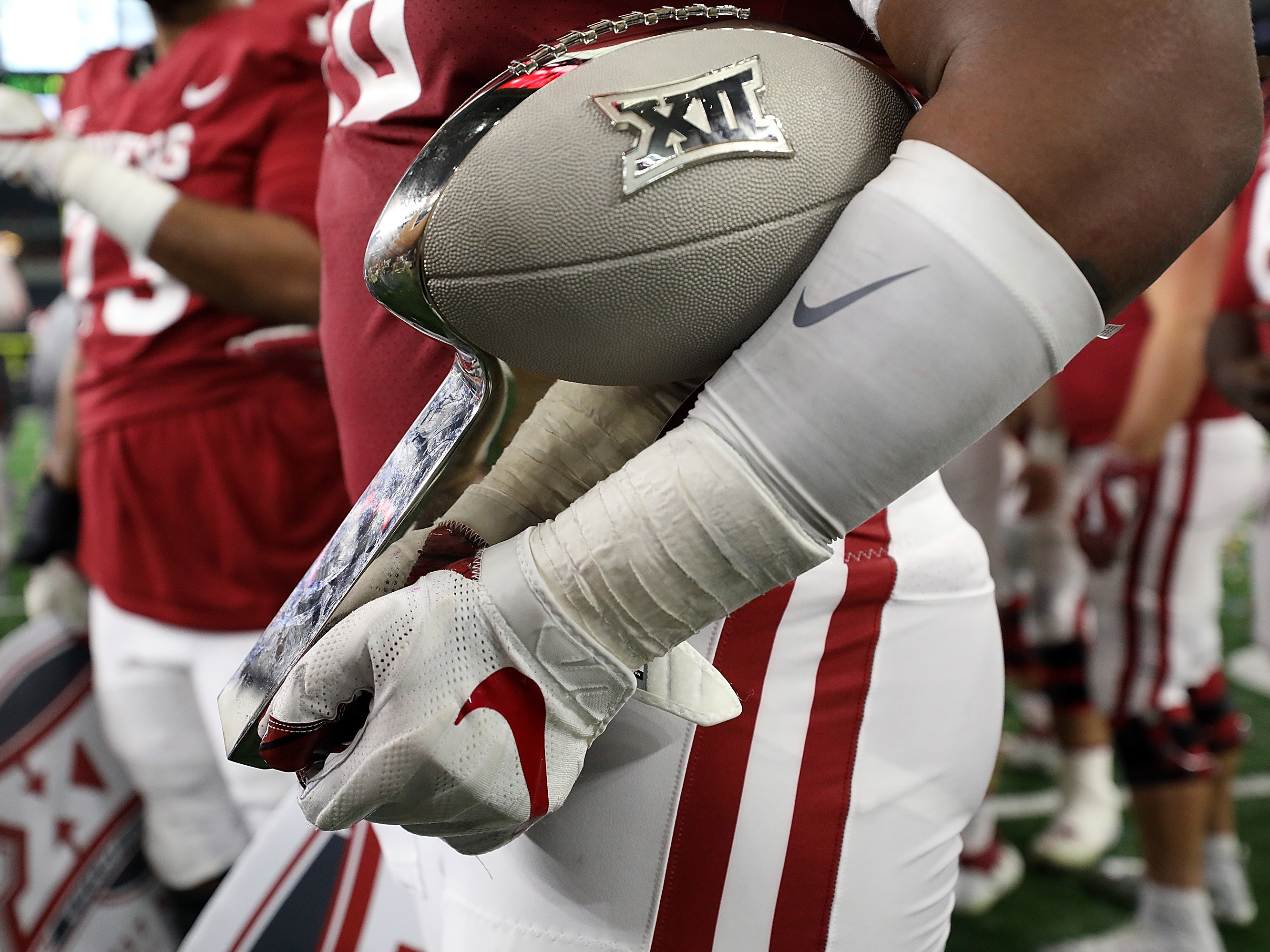 caption: The Big 12 says its schools will start playing their conference games in late September, under a schedule that's been reduced due to the coronavirus. The conference hopes to hold a championship game in December.