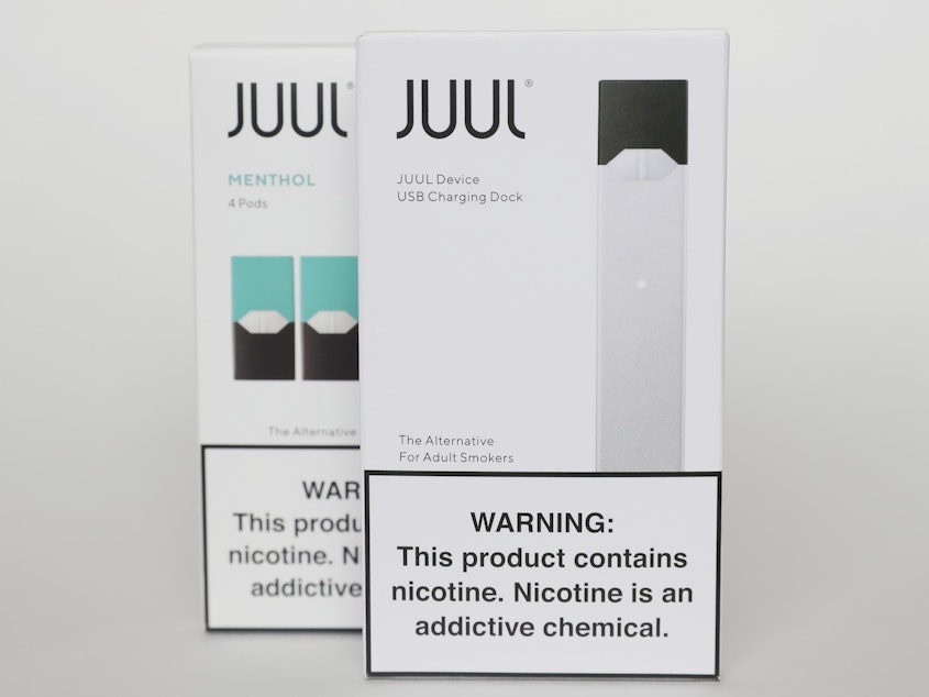 caption: Packaging for an electronic cigarette and menthol pods from Juul Labs is displayed on Feb. 25, 2020, in Pembroke Pines, Fla. In a deal announced Tuesday, Juul will pay nearly $440 million to settle a two-year investigation by 33 states into the marketing of its high-nicotine vaping products.