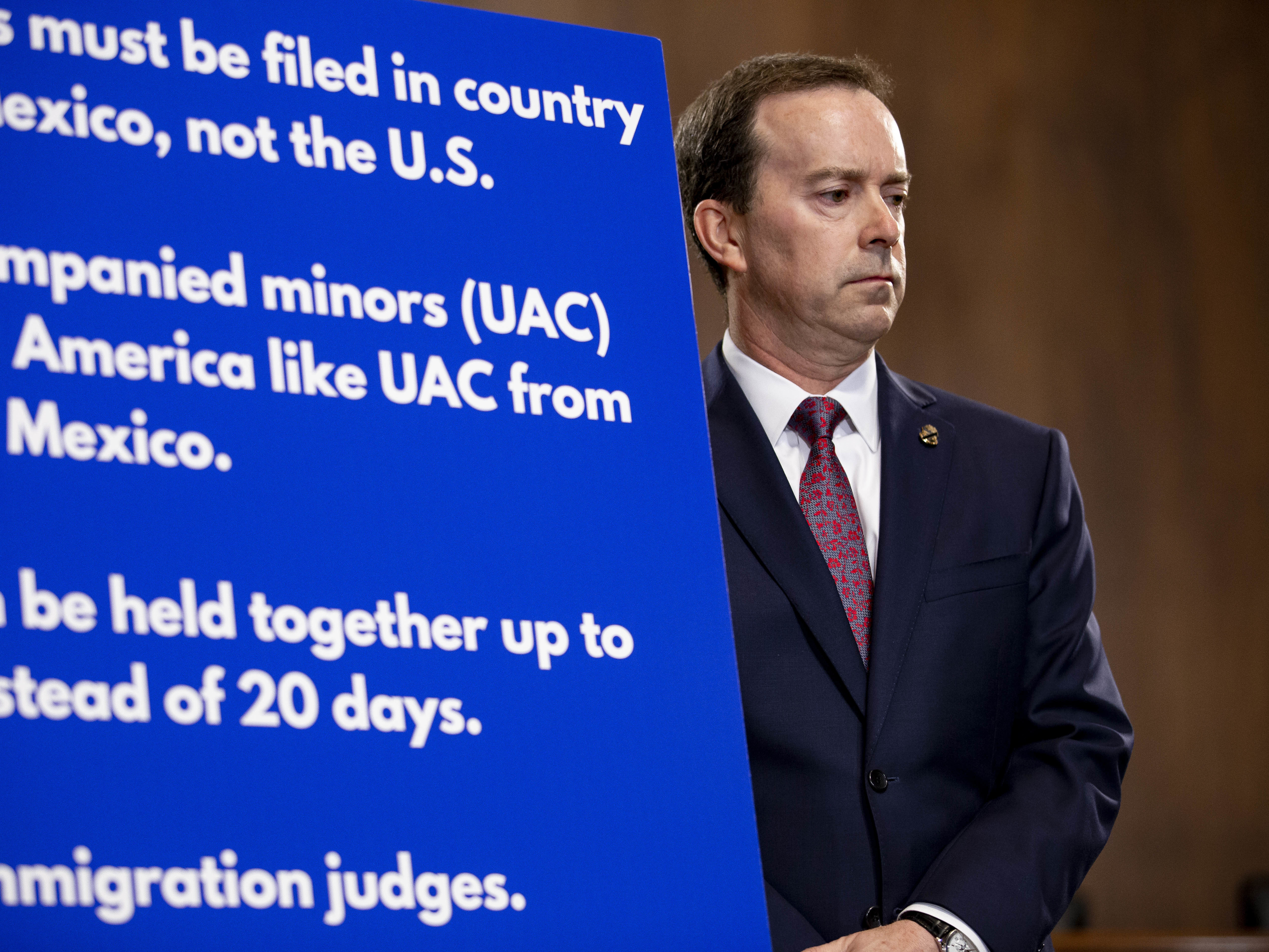 caption: John Sanders, then the acting commissioner of U.S. Customs and Border Protection, attends a news conference on Capitol Hill in 2019 during a surge of migrants at the U.S.-Mexico border, when at least five children died after being detained by federal authorities.