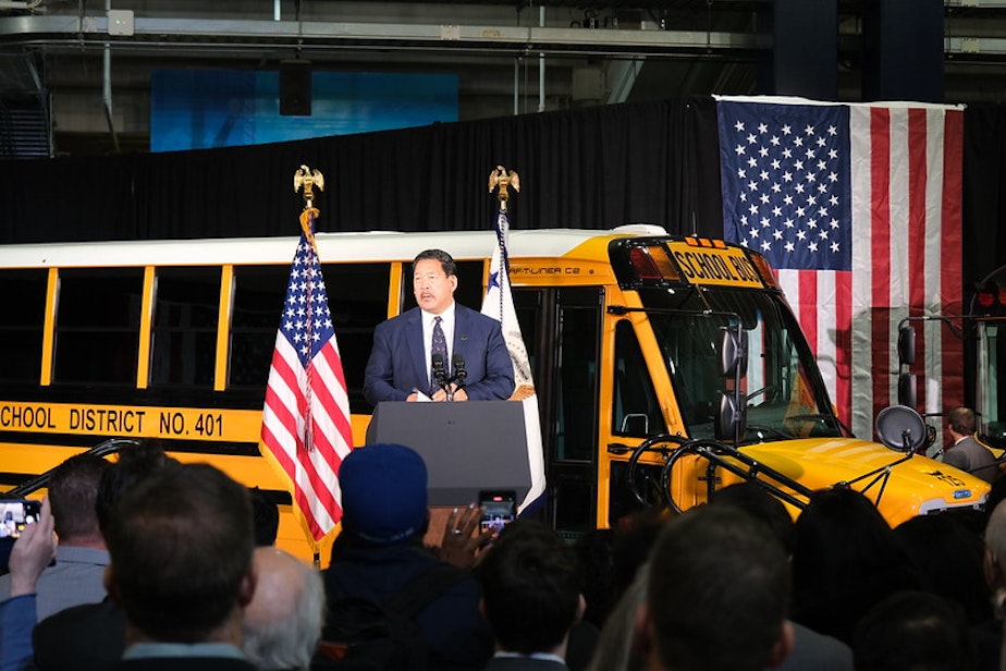 caption: Seattle Mayor Bruce Harrell in October 2022 at an announcement for new electric school buses coming to Washington state communities. Funding for the new buses was provided by the Clean School Bus Program that is part of the Bipartisan Infrastructure Law.  
