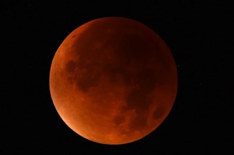 caption: A "blood moon" seen from western Germany during a total lunar eclipse on Sept. 28, 2015.