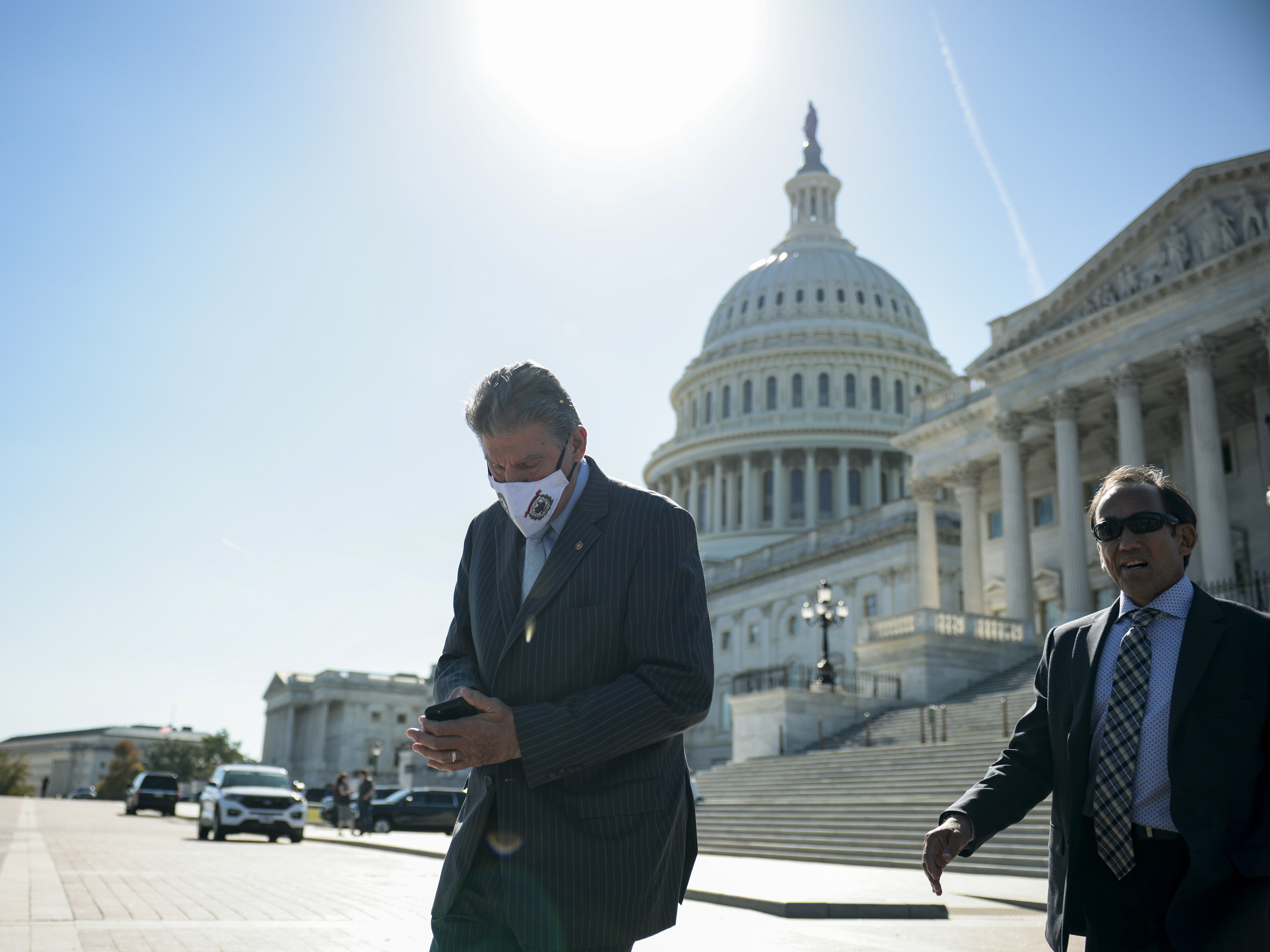 caption: West Virginia Sen. Joe Manchin is seen leaving the U.S. Capitol after a Senate vote on Wednesday.