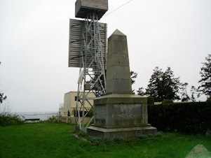 caption: Boundary marker number 1 on the U.S.-Canada border is at the edge of the now-isolated enclave of Point Roberts, Washington.