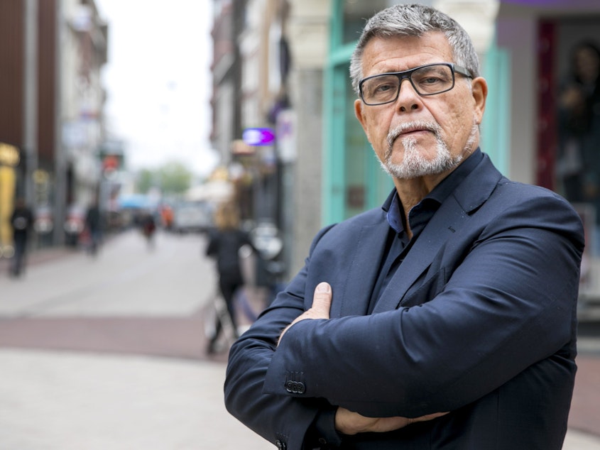 caption: Emile Ratelband, a 69-year-old Dutch man, says having a younger age on paper would give him a boost in life and on dating apps.
