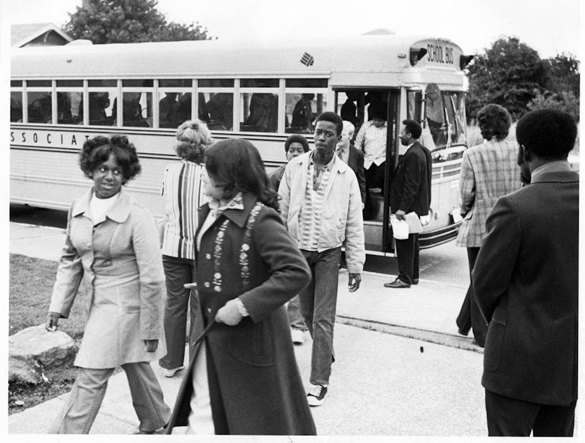 caption: As part of a Seattle Public Schools program, students were bused from different neighborhoods to improve racial mixes.
