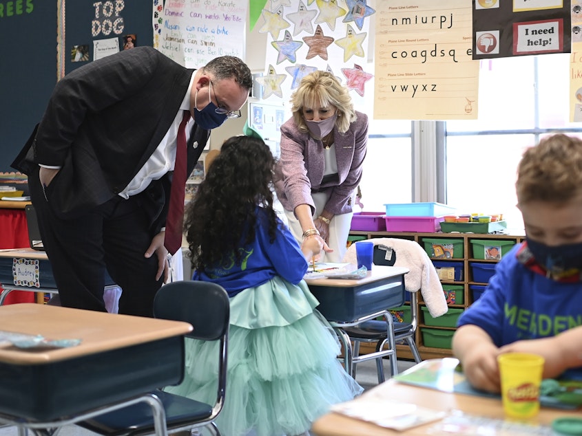 caption: First lady Jill Biden and Education Secretary Miguel Cardona tour Benjamin Franklin Elementary School in Meriden, Conn.