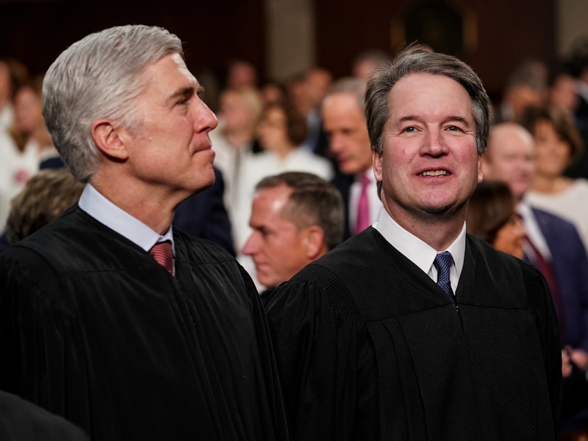 caption: Supreme Court Justices Neil Gorsuch (left) and Brett Kavanaugh wrote opposing opinions in a high-profile case involving Apple's App Store. The two Trump appointees are seen here at the Capitol in February.
