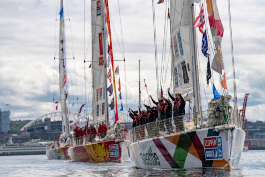 caption: Clipper race Visit Seattle team leads parade of sail.