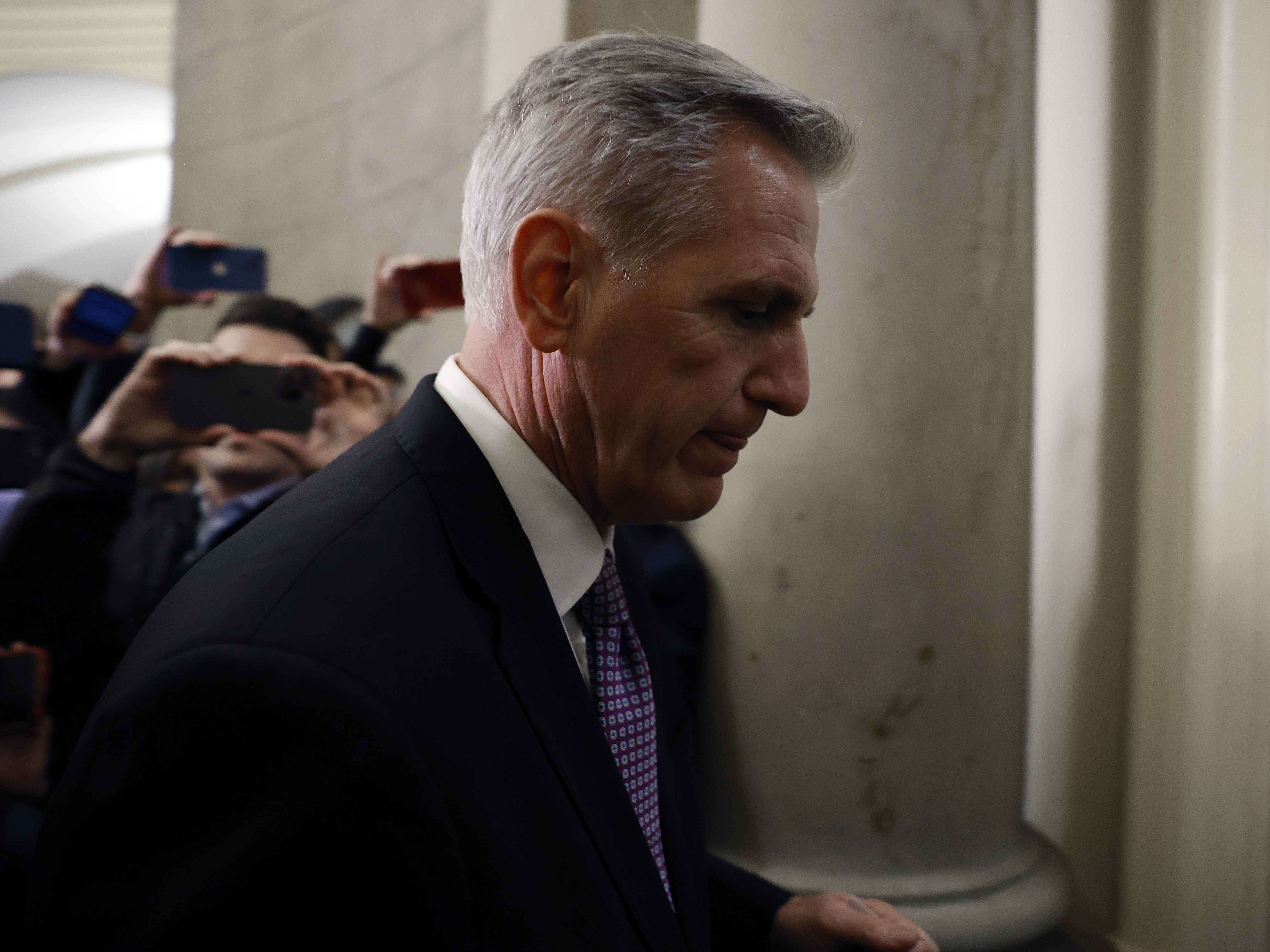 caption: Rep. Kevin McCarthy, R-Calif., returns to his office following another disappointing day for the House majority leader. McCarthy has so far failed to become speaker after six rounds of votes.