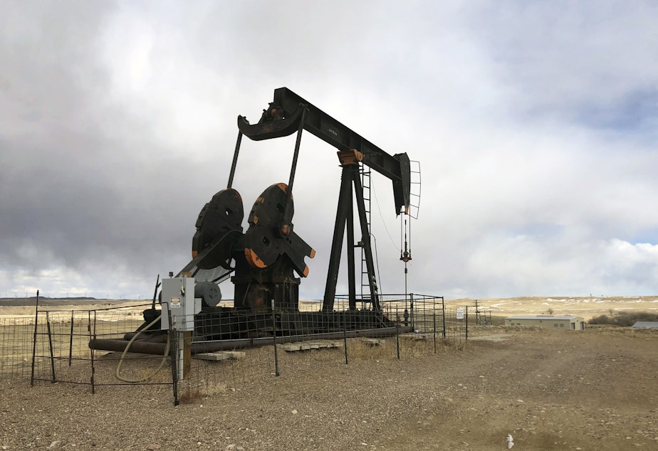 caption: An oil well is seen east of Casper, Wyo., on  Feb. 26, 2021. The Biden administration is raising royalty rates that companies must pay for oil and natural gas extracted from federal lands.