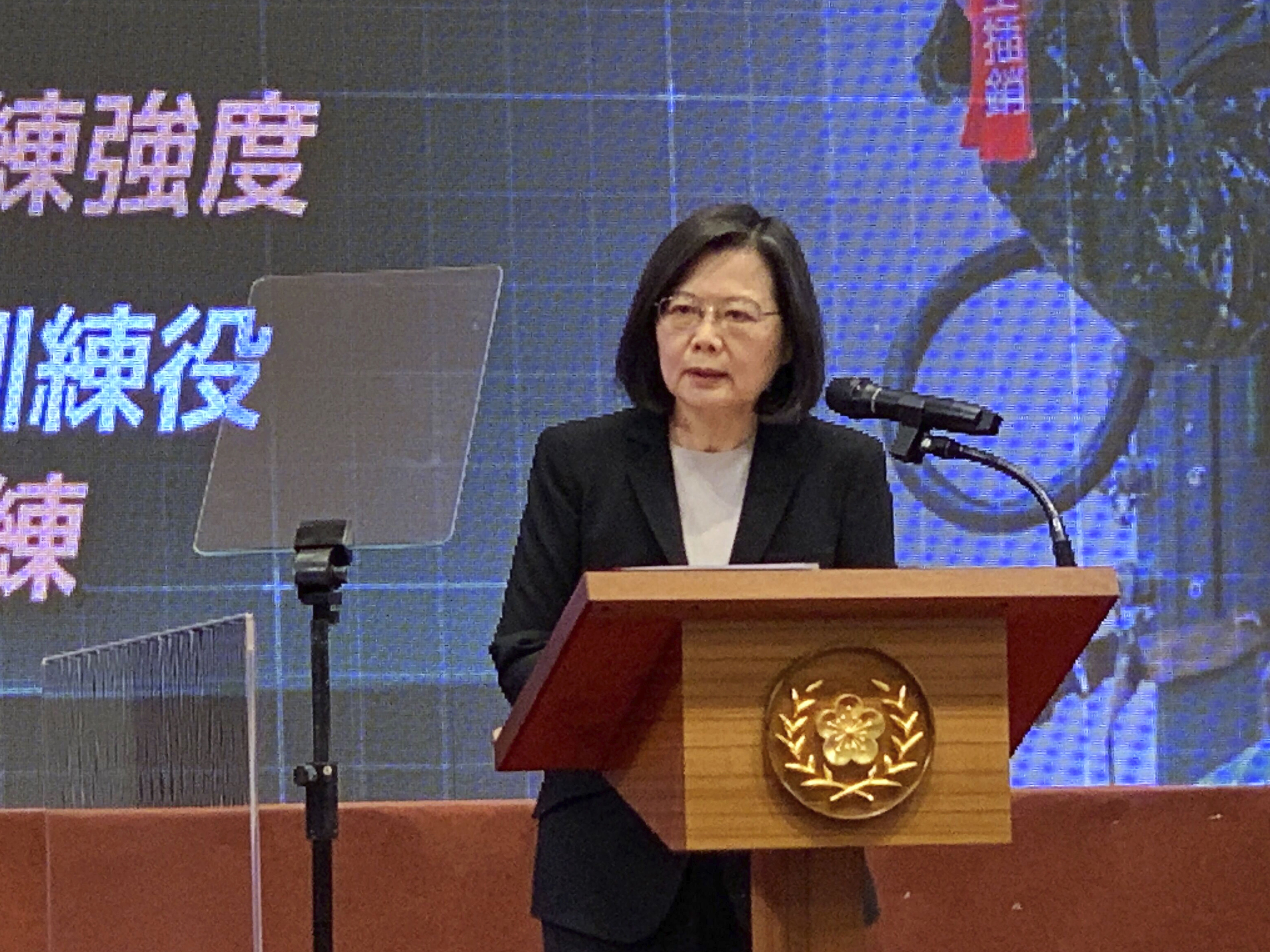 caption: Taiwanese President Tsai Ing-wen speaks during Tuesday's announcement of the extension of the island's compulsory military service.