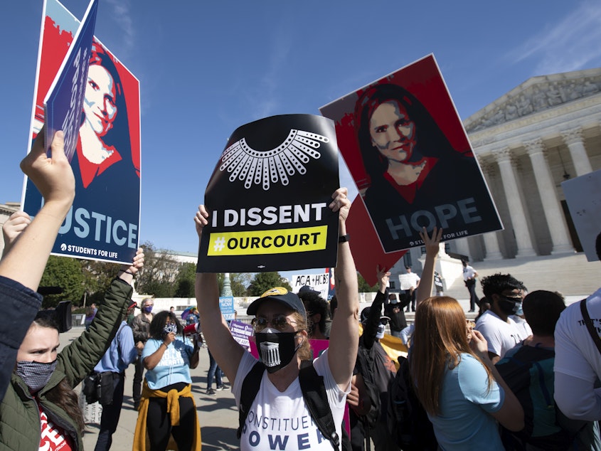 caption: Supporters and opponents of the confirmation of Judge Amy Coney Barrett rally Wednesday at the Supreme Court. On Thursday, witnesses will speak at the Senate Judiciary Committee for and against President Trump's nominee to the court.