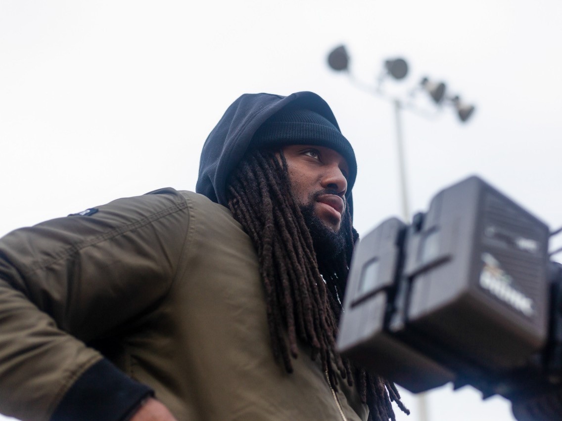 caption: Rashad Frett, on a film set