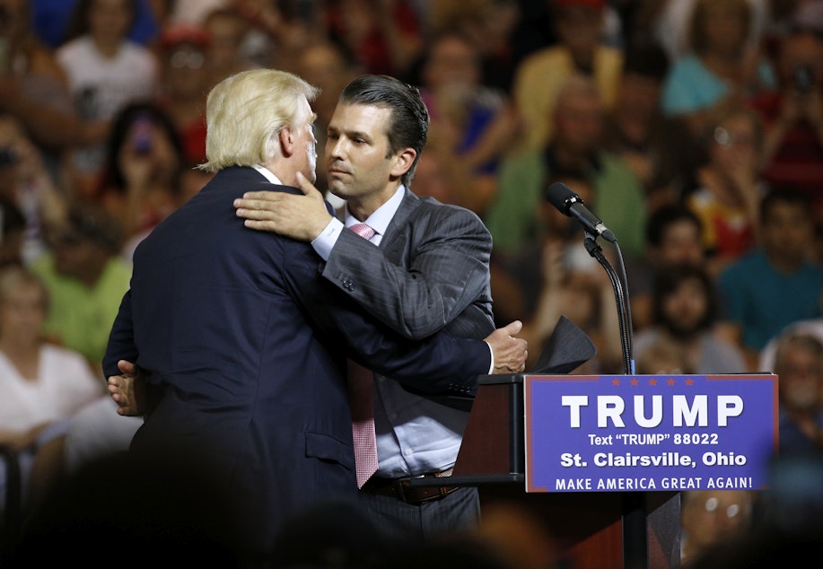 caption: Then Republican presidential candidate Donald Trump, left, hugs his son Donald Trump Jr. during a rally at Ohio University Eastern Campus in St. Clairsville, Ohio, Tuesday, June 28, 2016.