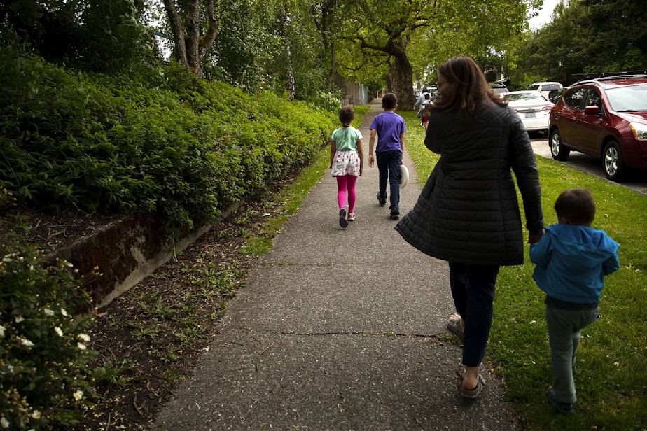 caption: Kadie Bell Sata walks with her kids to the Greenlake Elementary playground after school on Monday, June 3, 2024, in Seattle. 