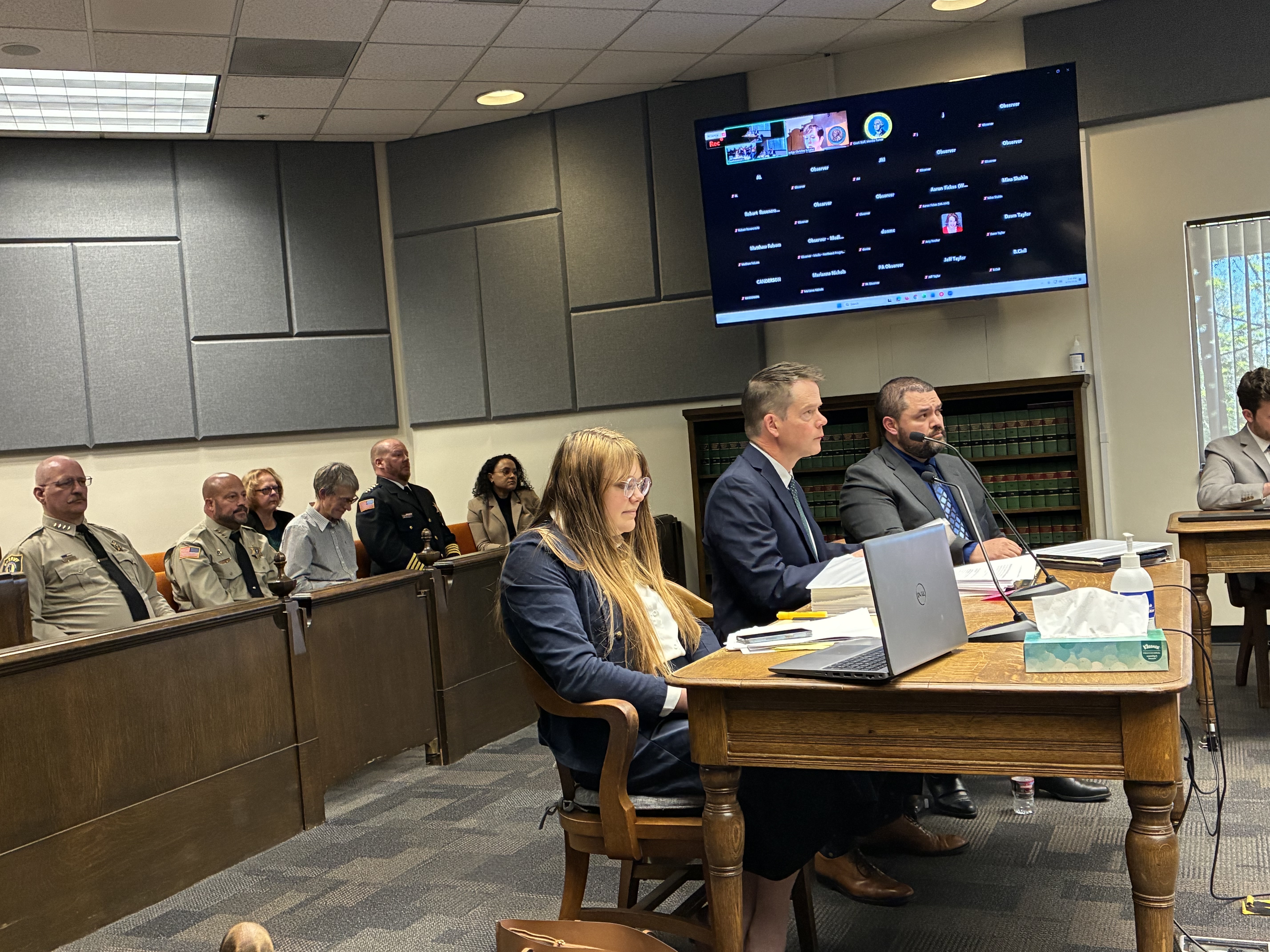 caption: Attorney Mark Lamb, who has been leading the lawsuit, speaks to the Thurston County judge on Wednesday. Behind him are the four sheriffs running for reelection he is representing.