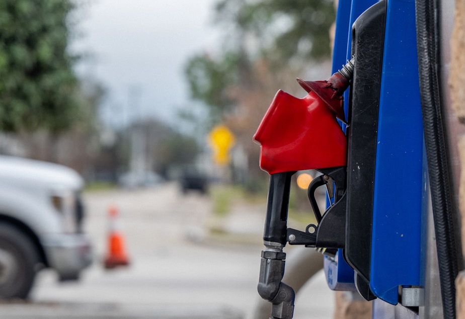 caption: A gas pump is seen in a station on Feb. 1 in Houston. Gasoline prices hit a new national record, not adjusted for inflation, surpassing the previous peak set around two months ago.
