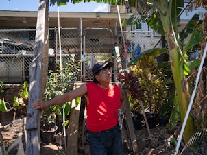 caption: Danilo Andres, 60, outside his home in Lahaina. The fire jumped his home and a surrounding cluster.