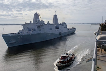 caption: The USS Arlington, shown in December in Morehead City, N.C., has been sent to the Middle East to bolster an aircraft carrier force sent to counter alleged threats from Iran.