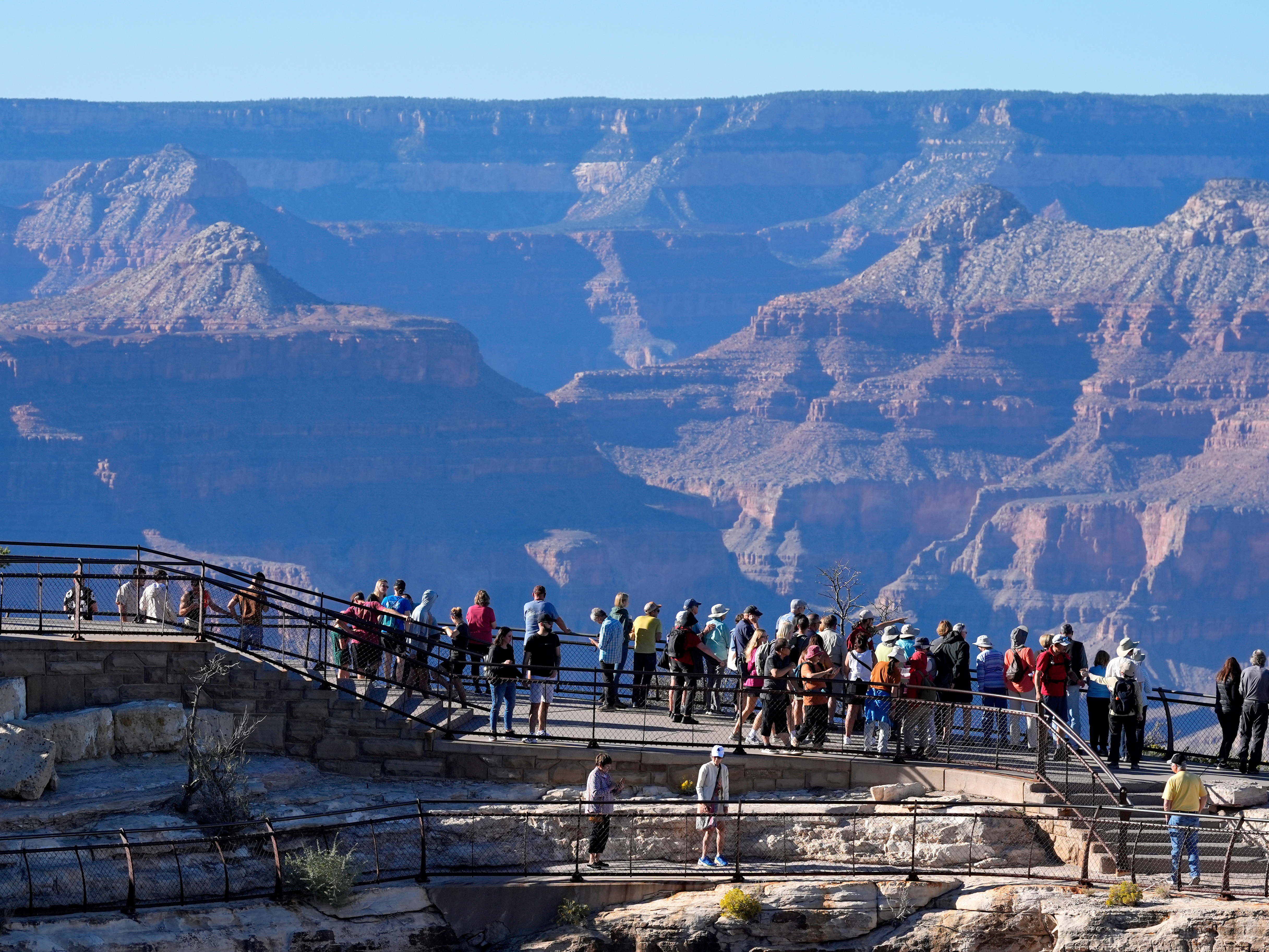 caption: Tourists flock to Mather Point at Grand Canyon National Park, Oct. 1, 2025, in Grand Canyon, Ariz.